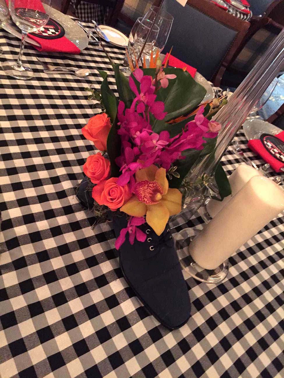 Bright floral bouquet in a black 50's style sneaker on a table